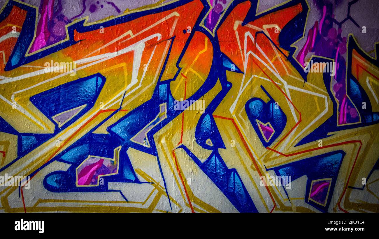 colorful abstract wildstyle graffiti painting or artwork on a wall with ...