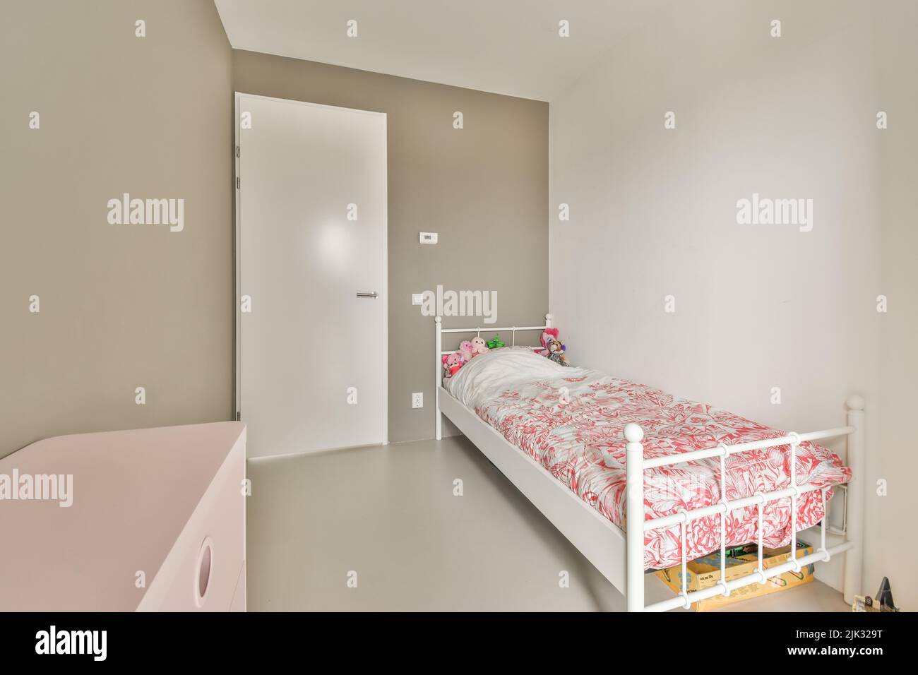 Interior of modern kid bedroom with bed and shelves with various toys at home Stock Photo
