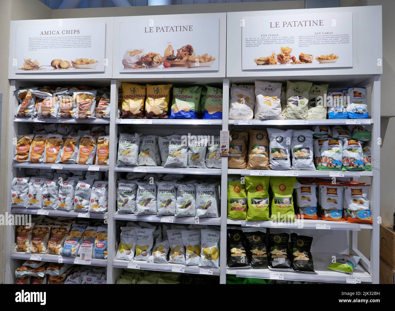 PACKETS OF FRENCH FRIES ON A SHELF INSIDE THE EATALY FOOD STORE Stock