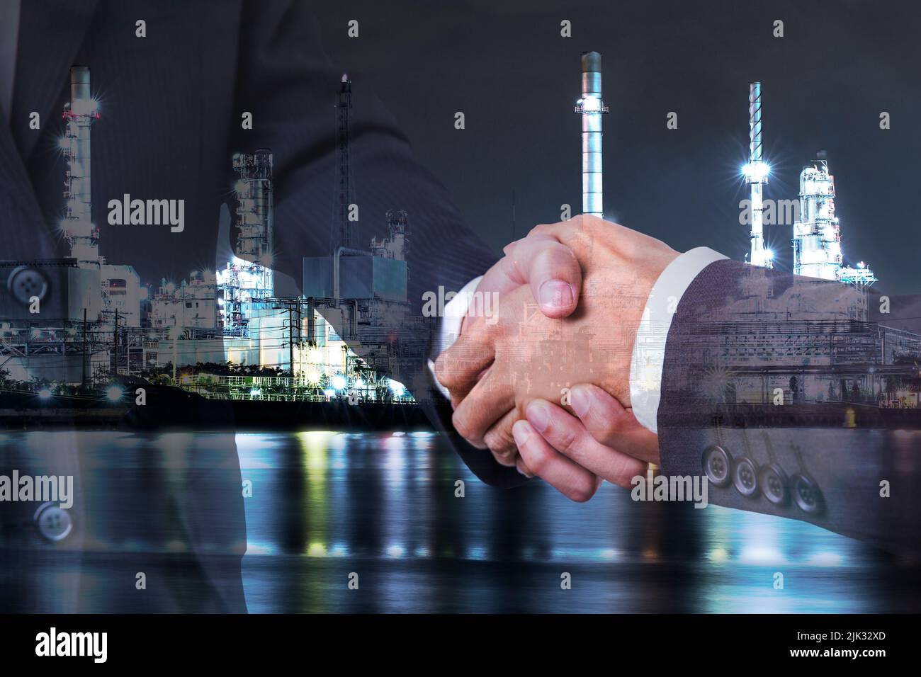 Double exposure of business partner handshake and Oil and Gas Refinery plant industry factory background Stock Photo