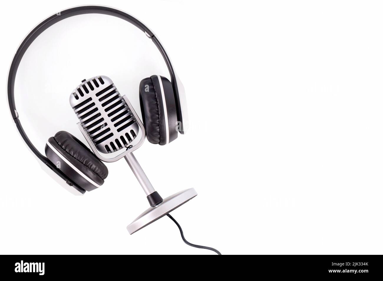 Retro microphone and headphones isolated on white background Stock