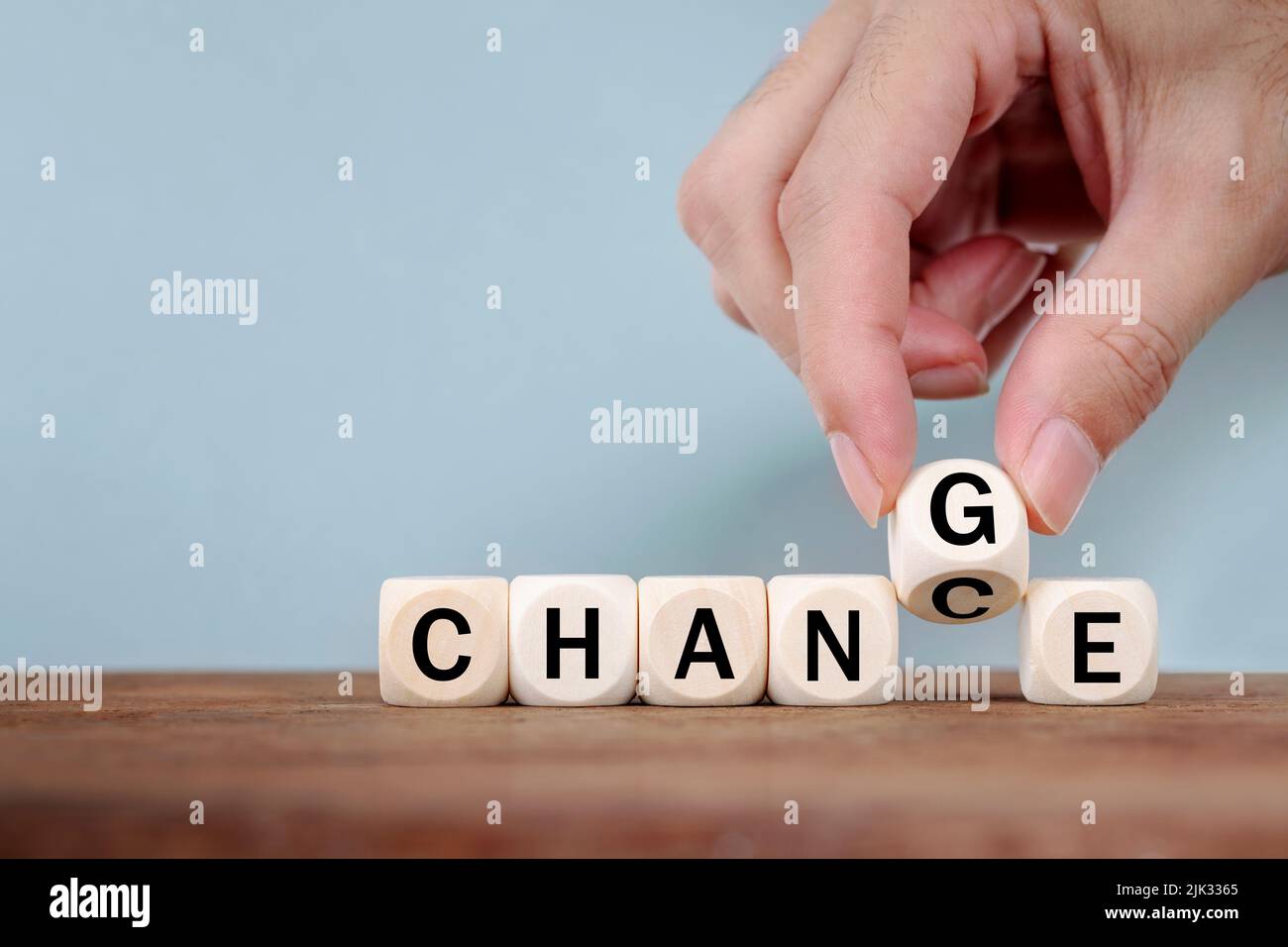 Hand Changing word from CHANCE  to CHANGE On Wooden Cube Stock Photo