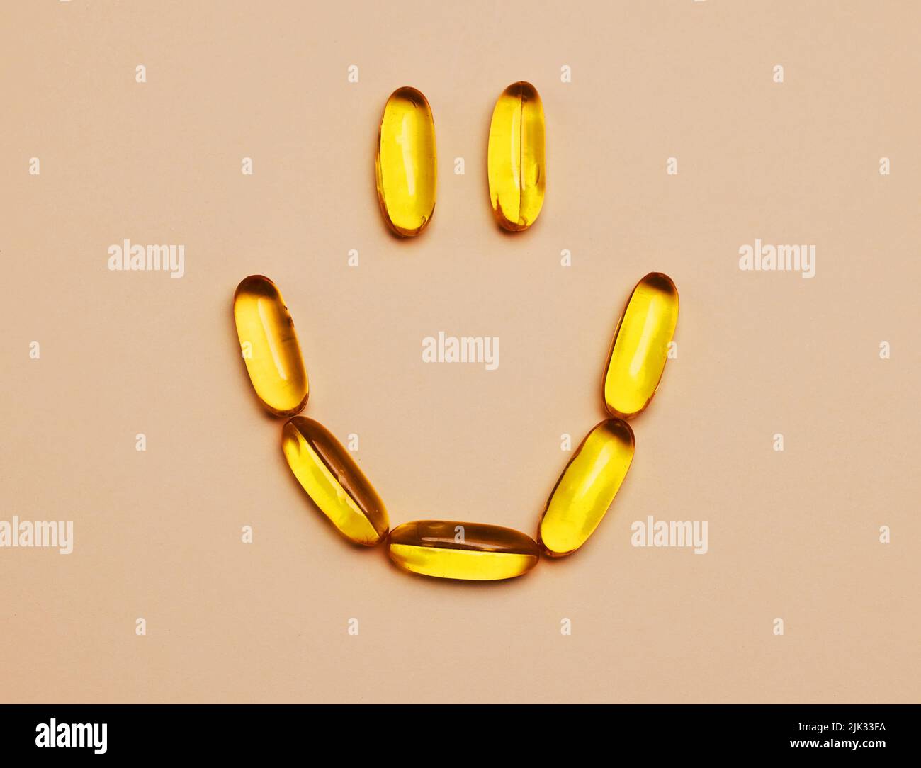 A pill to keep the smile on your face. Studio shot of pills forming a ...