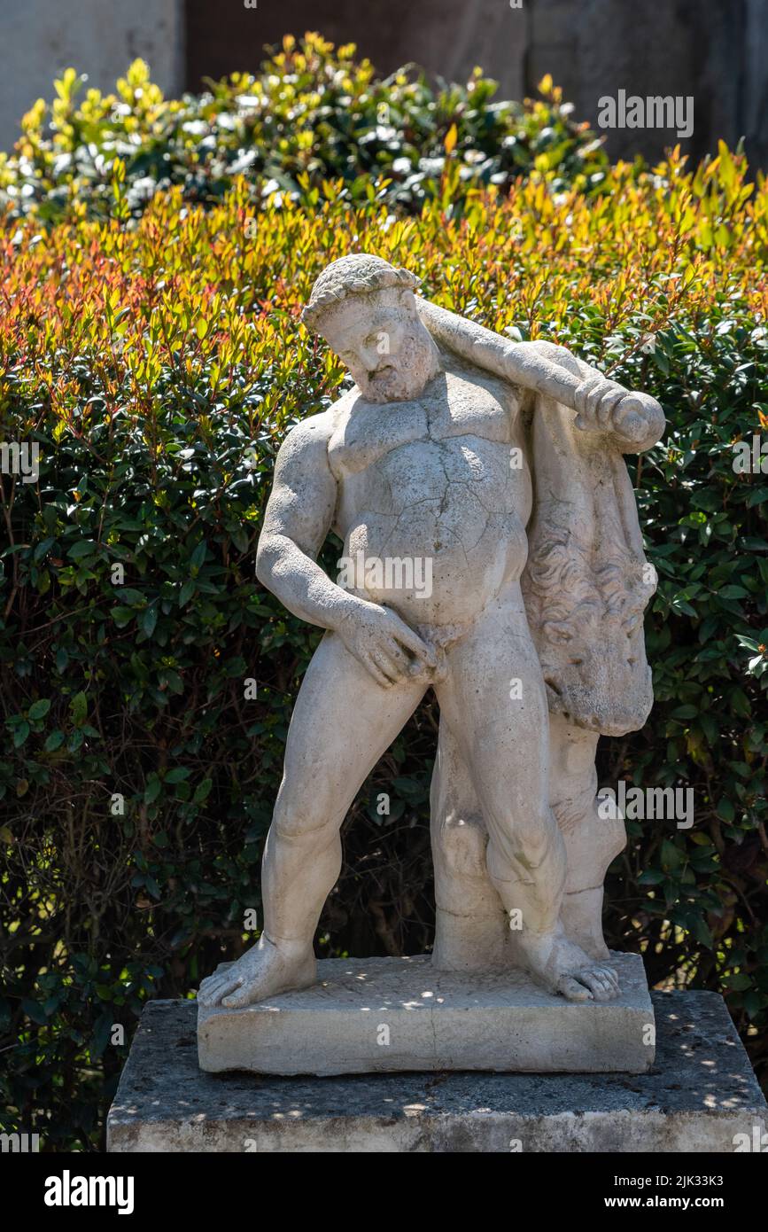 Ancient statues in a private garden of a typical Roman villa in