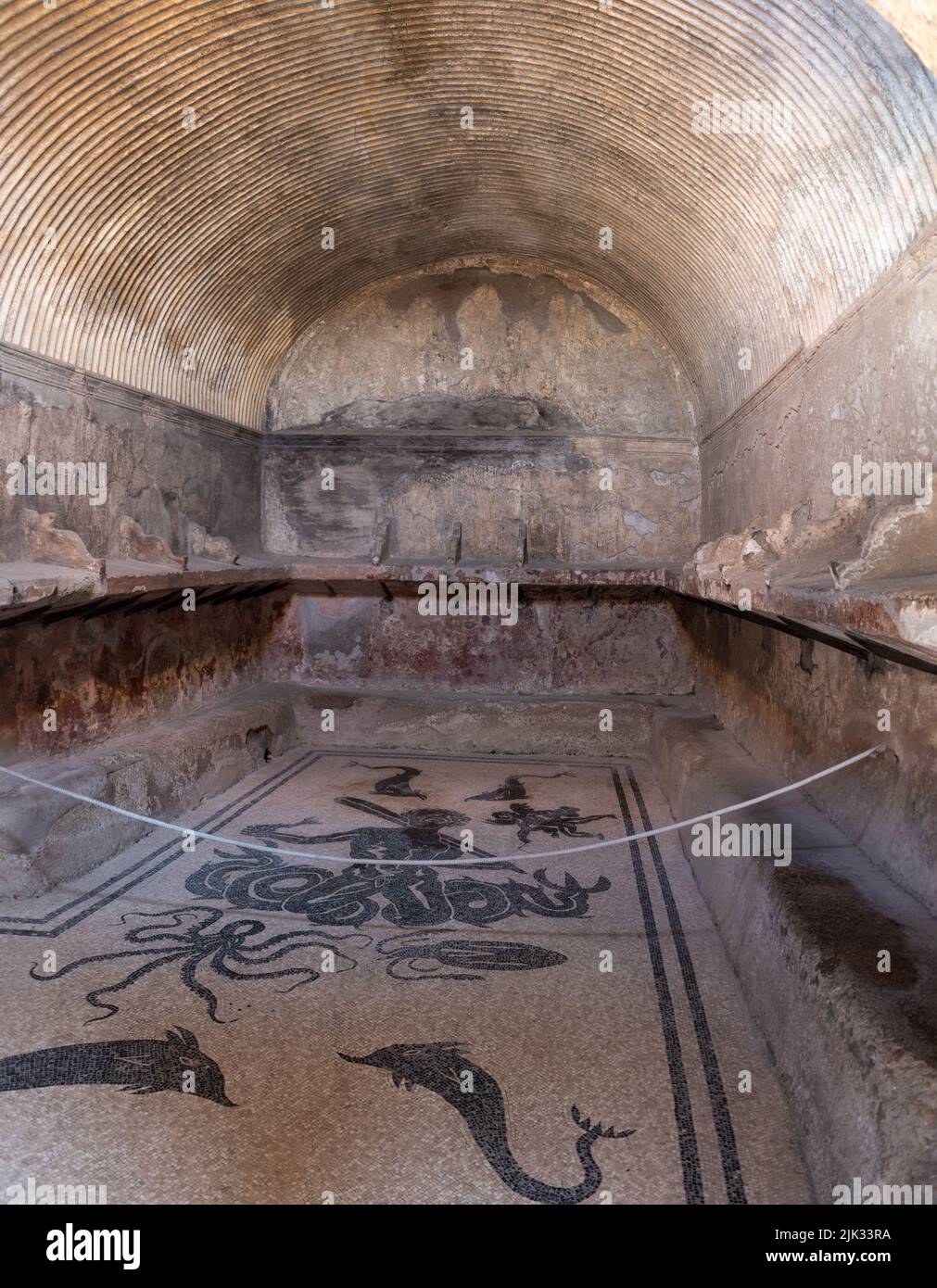HERCULANEUM, ITALY - MAY 04, 2022 - Ancient men's themral baths in the Roman city of Herculaneum, Italy Stock Photo