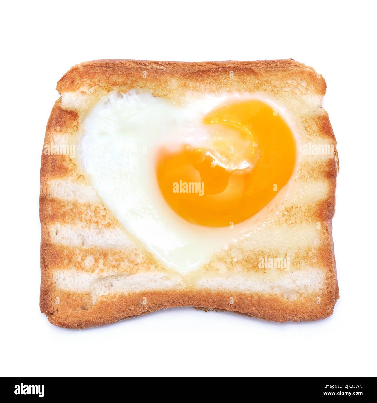 Heart shaped fried eggs in a Toasted bread with grill marks isolated on