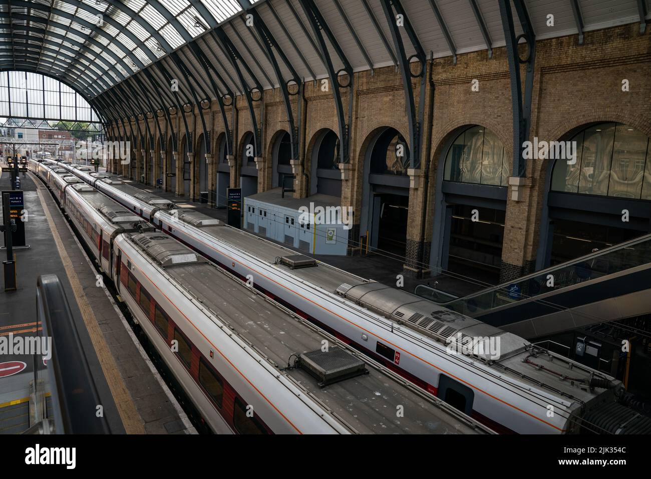 Two trains on the tracks in Kings Cross train station as members of the Rail, Maritime and Transport union (RMT) take part in a fresh strike over jobs, pay and conditions. Picture date: Wednesday July 27, 2022. Stock Photo