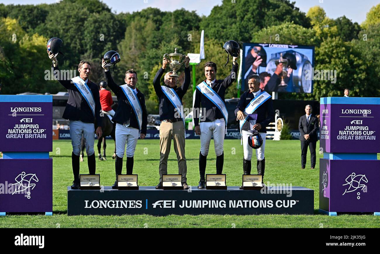 Hassocks, UK. 29th July, 2022. The Longines Royal International Horse show. Hickstead Showground. Hassocks. The winning team (France) with the Edward, Prince of Wales trophy. (l to r) Kevin Staut, Marc Dilasser, Henk Nooren (Chef Dequipe) holding trophy, Edward Levy and Olivier Robert. Longines FEI jumping nations cup of Great Britain. Credit: Sport In Pictures/Alamy Live News Stock Photo