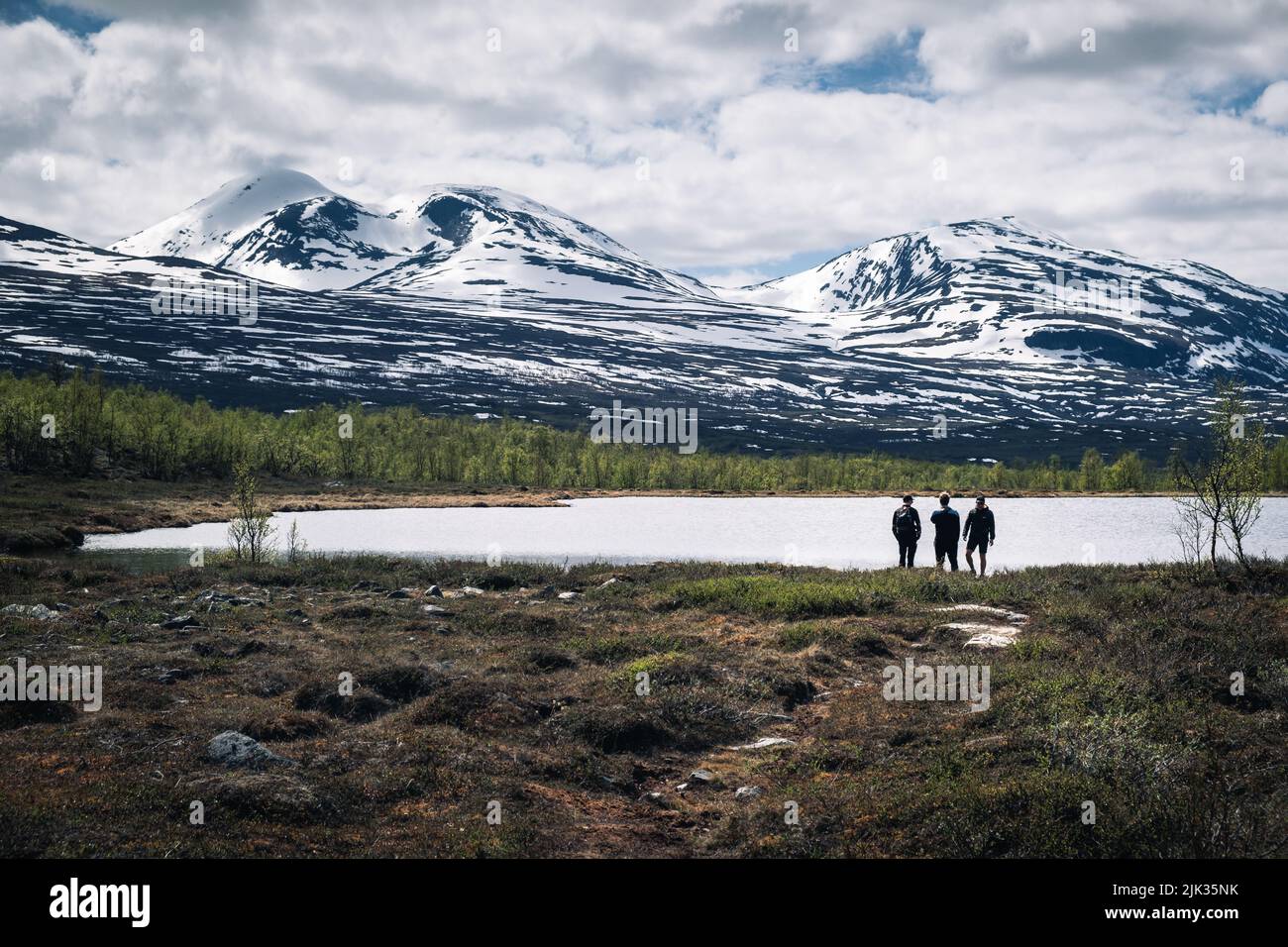 Exploring lakes and mountains in the Swedish Arctic Stock Photo