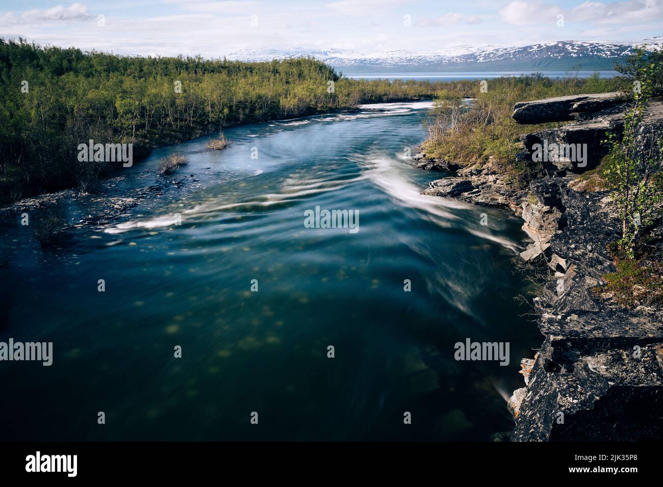 Abisko river flowing in to Lake Tornetrask, Sweden Stock Photo
