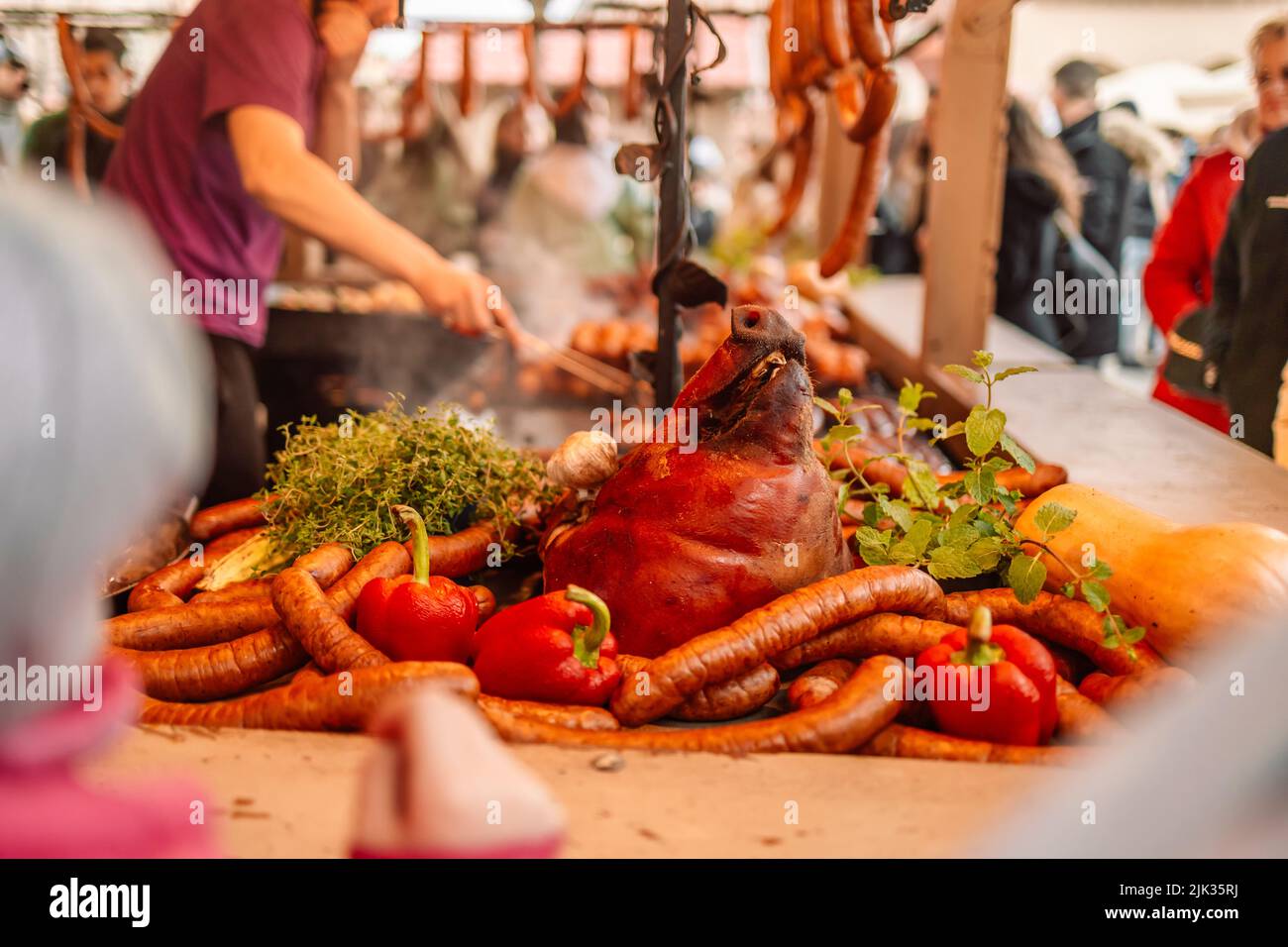 Fried baked sausages, hot dog on street food outdoor market stall in
