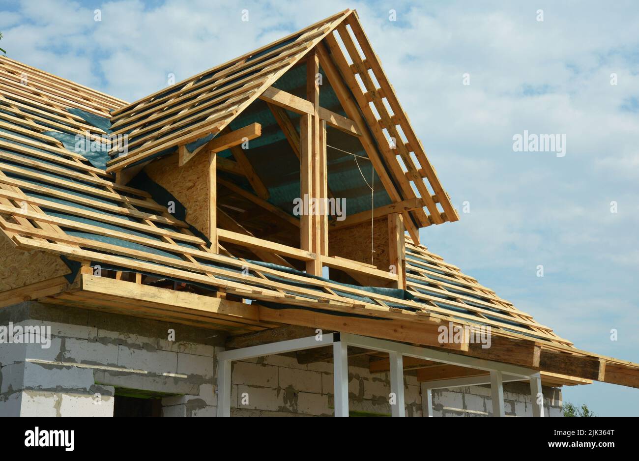 An unfinished attic roofing construction. Roof framing of an attic with