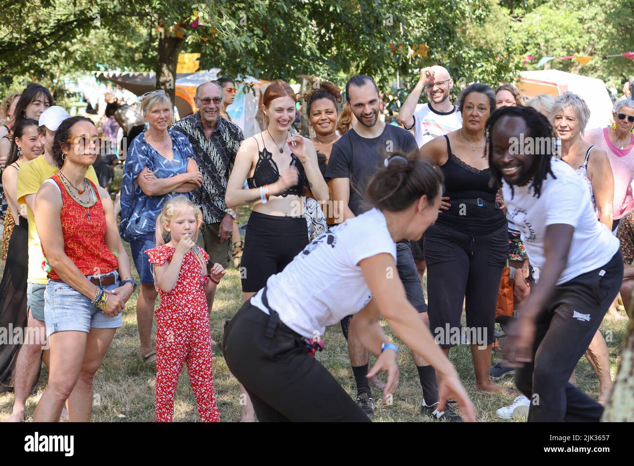 Wiltshire, UK. 29th July, 2022. 29th July 2022, Womad Festival, Charlton Park, Malmesbury, Wiltshire.  Brazilian Capoeira workshop in the beautiful leafy surroundings of the arboretum  The WOMAD Festival held its first event in 1982 at the Bath and West Showground in Shepton Mallet, Somerset. Over the intervening 40 years, the Peter Gabriel fronted organisation has hosted festivals across the globe, from Spain to New Zealand, Chile to Abu Dhabi. For the 40th anniversary its flagship UK festival is held this weekend from 28-30 July at Charlton Park. WOMAD - World of Music, Arts and Dance. Credi Stock Photo