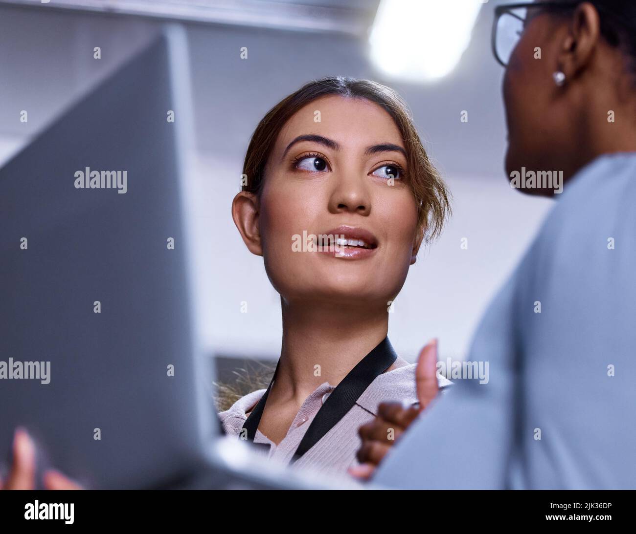 System check Complete. two attractive young female computer programmers
