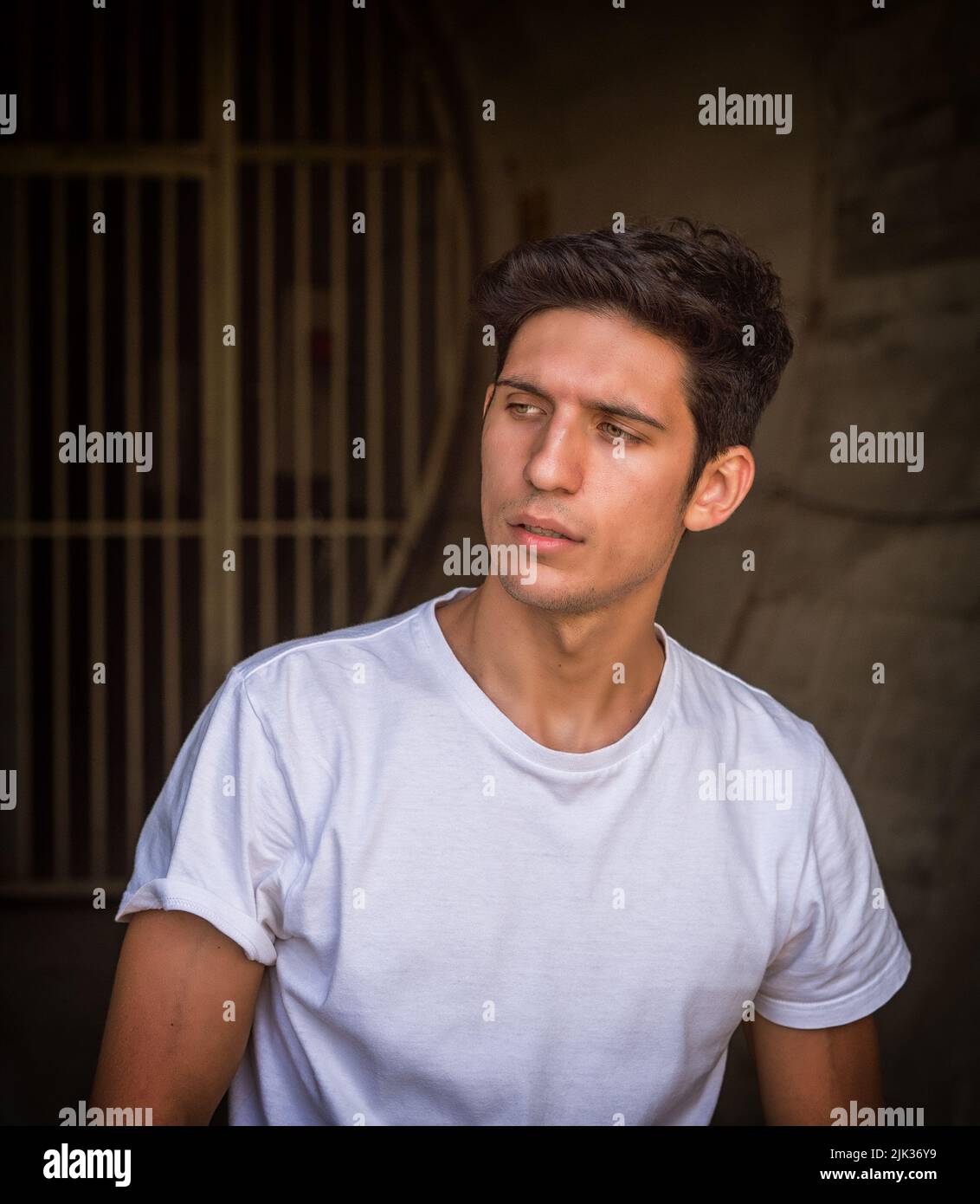 Attractive green eyed young man, looking away to a side Stock Photo