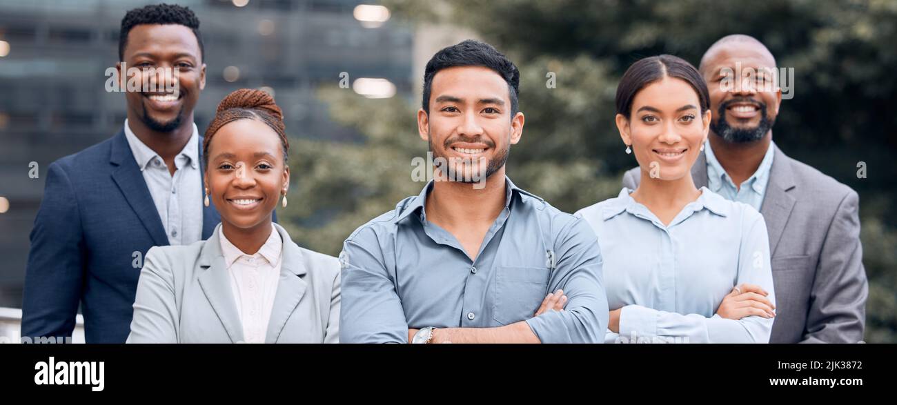 Were so happy with our progress. a group of businesspeople standing outside together. Stock Photo