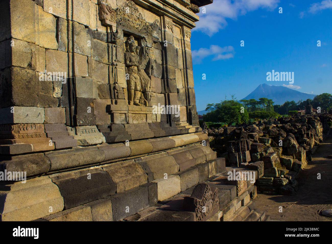 Candi Plaosan, a Buddhist temple located in Klaten Central Java, Indonesia, with a background of Mount Merapi Stock Photo