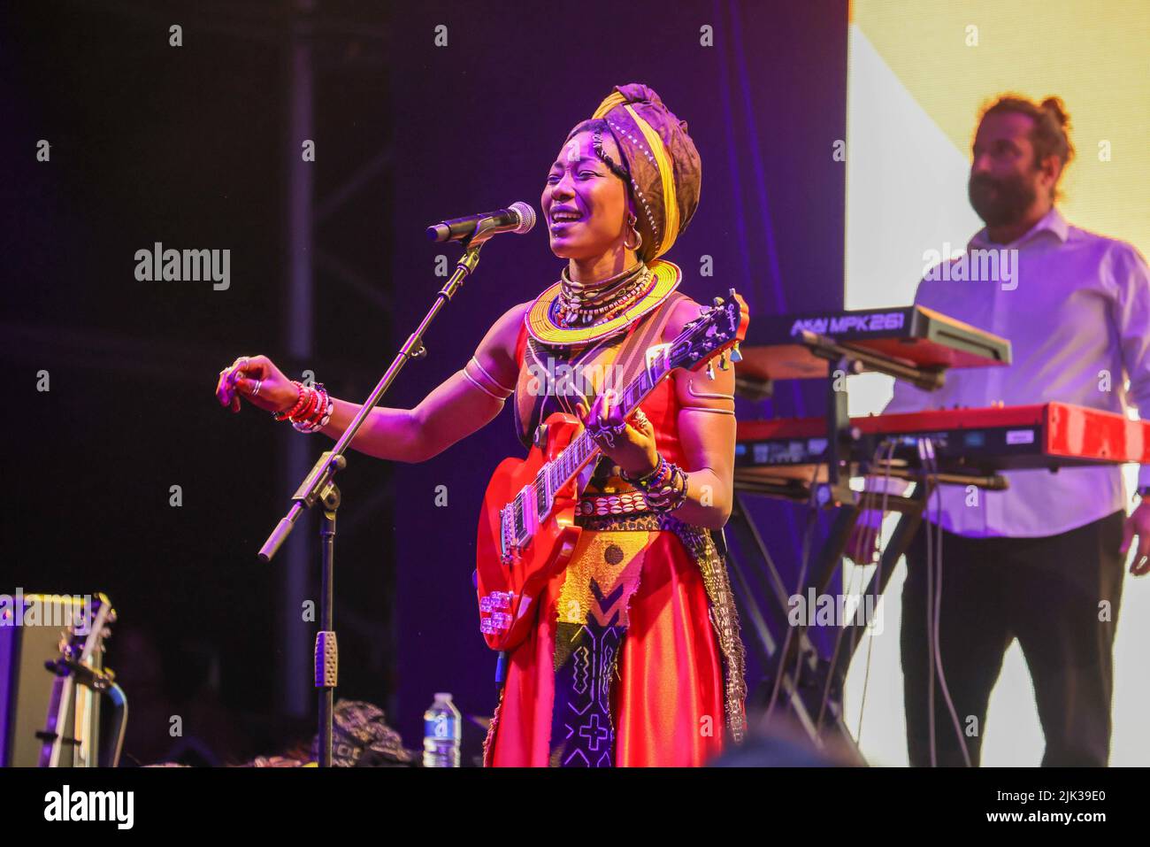 Wiltshire, UK. 29th July, 2022. 30th July 2022, Womad Festival, Charlton Park, Malmesbury, Wiltshire. Fatoumata Diawara performs traditional and modern mix of Malian songs on the Open Air stage.  The WOMAD Festival held its first event in 1982 at the Bath and West Showground in Shepton Mallet, Somerset. Over the intervening 40 years, the Peter Gabriel fronted organisation has hosted festivals across the globe, from Spain to New Zealand, Chile to Abu Dhabi. For the 40th anniversary its flagship UK festival is held this weekend from 28-30 July at Charlton Park. WOMAD - World of Music, Arts and D Stock Photo