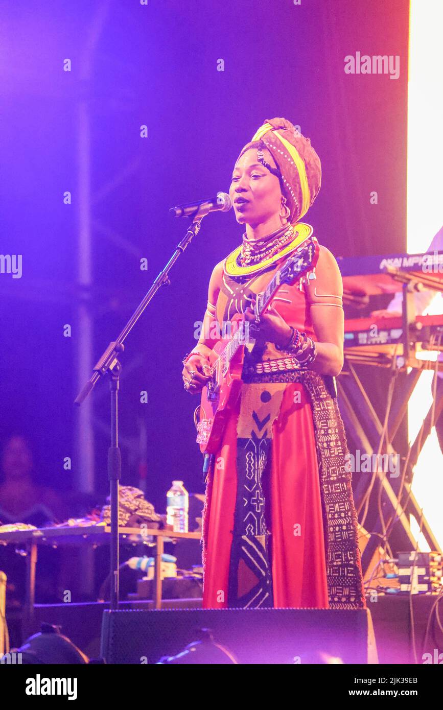 Wiltshire, UK. 29th July, 2022. 30th July 2022, Womad Festival, Charlton Park, Malmesbury, Wiltshire. Fatoumata Diawara performs traditional and modern mix of Malian songs on the Open Air stage.  The WOMAD Festival held its first event in 1982 at the Bath and West Showground in Shepton Mallet, Somerset. Over the intervening 40 years, the Peter Gabriel fronted organisation has hosted festivals across the globe, from Spain to New Zealand, Chile to Abu Dhabi. For the 40th anniversary its flagship UK festival is held this weekend from 28-30 July at Charlton Park. WOMAD - World of Music, Arts and D Stock Photo