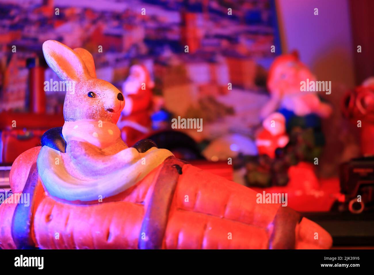 Rabbit statue decoration, blurred background. background under red light. Stock Photo