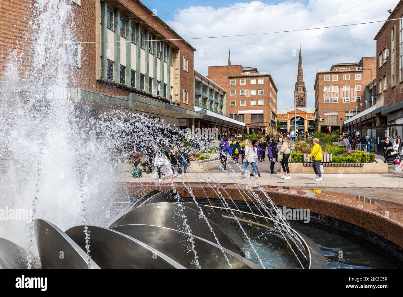 Coventry precinct with fountain and Coventry Cathedral spire in the background. Stock Photo