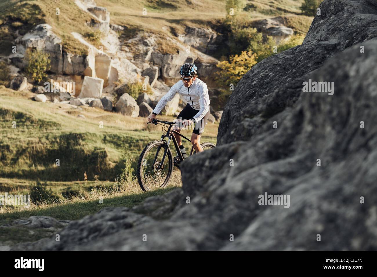 Professional Male Cyclist Riding Mountain Bike on the Trail Among Rocky Terrain Stock Photo Alamy