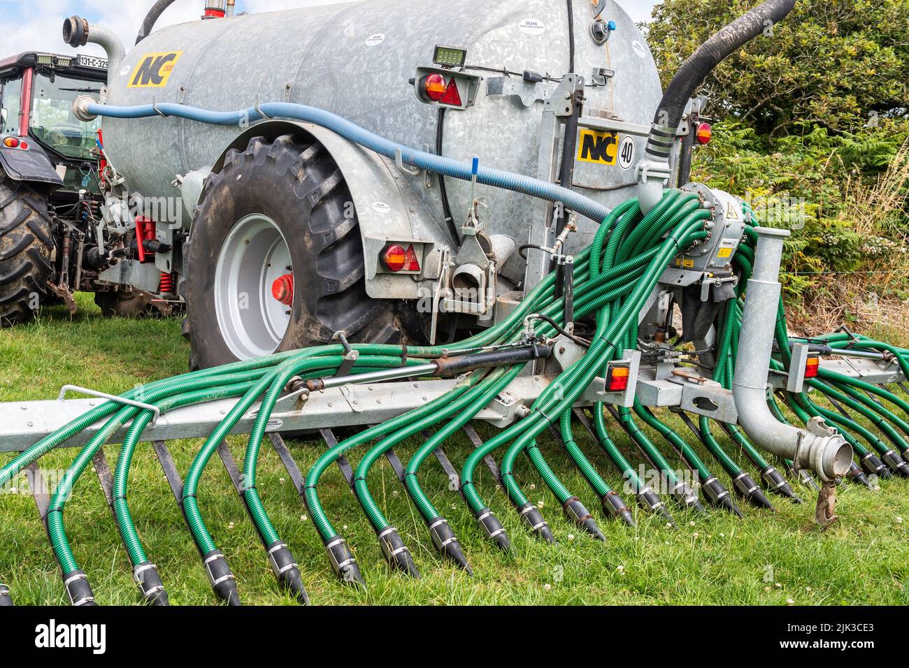 Trailing shoe slurry tanker with close up of dribble bars. Stock Photo
