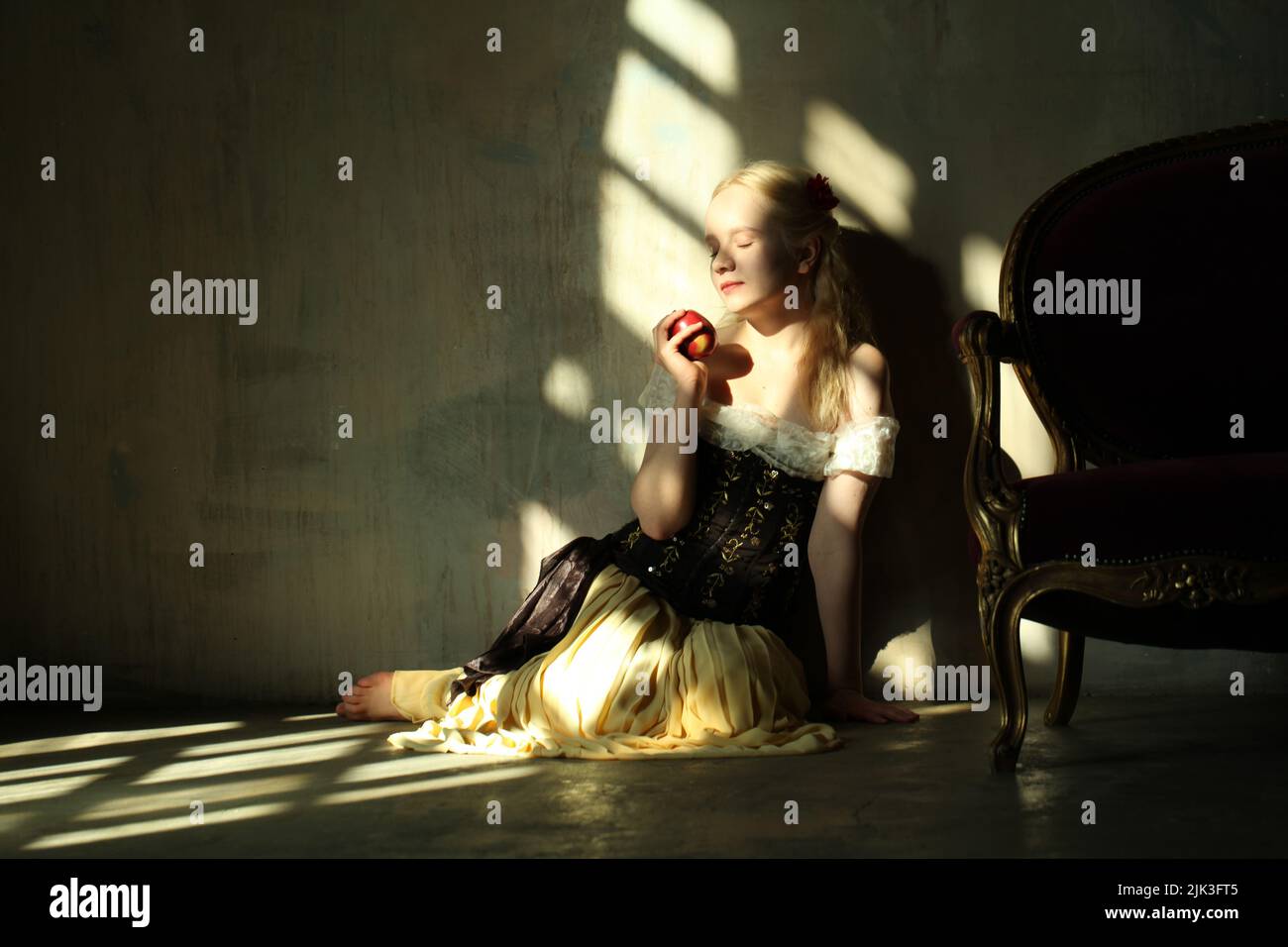 Young woman in conceptual light and shadow Stock Photo