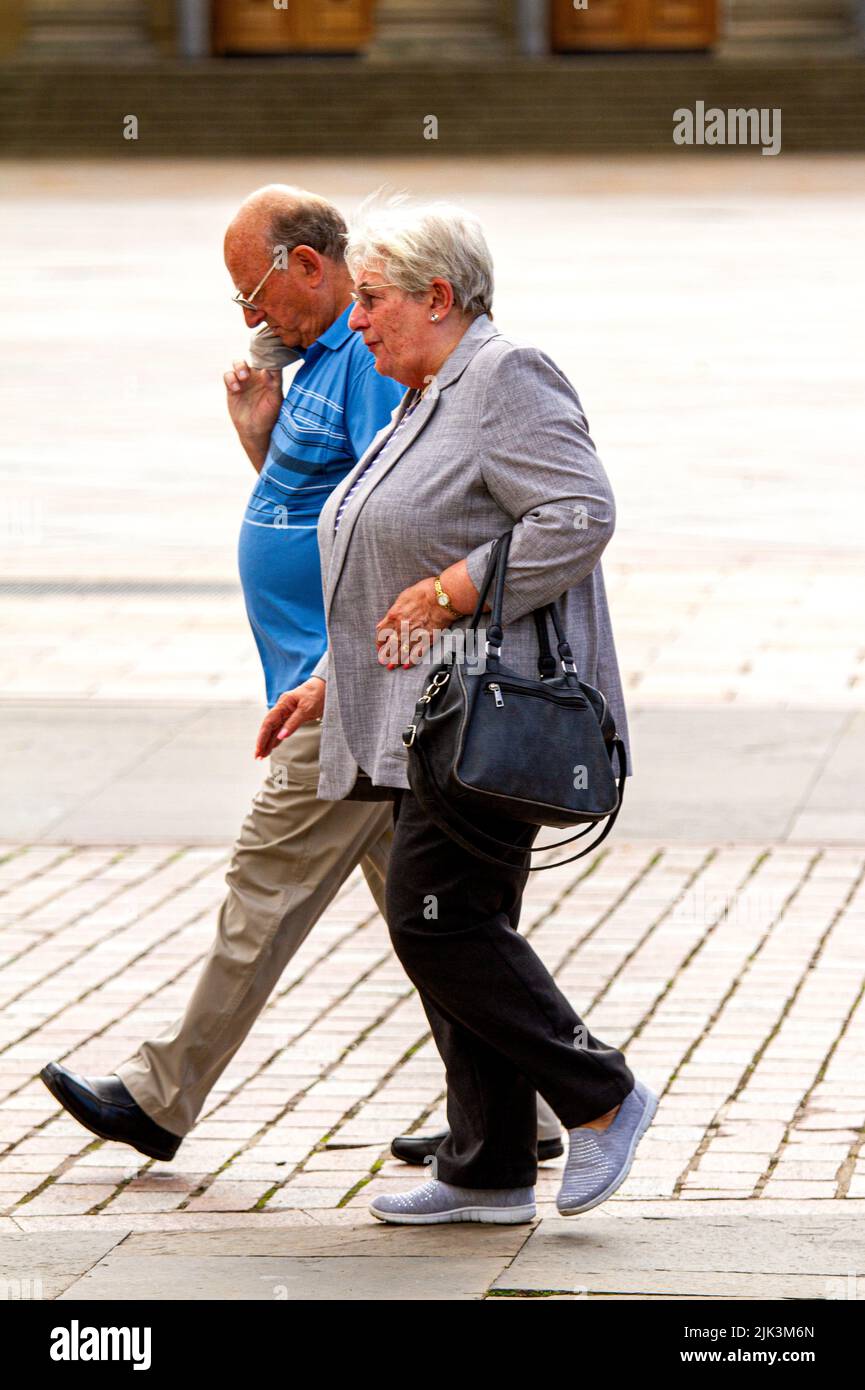 Dundee, Tayside, Scotland, UK. 30h July, 2022. UK Weather: Temperatures in North East Scotland reached 21°C due to the warm July sunshine. Senior couples are out and about in Dundee city centre enjoying the warm summer weather while shopping. Credit: Dundee Photographics/Alamy Live News Stock Photo
