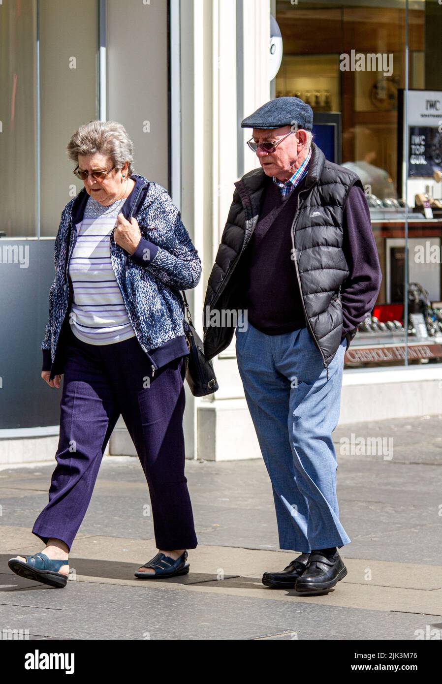 Dundee, Tayside, Scotland, UK. 30h July, 2022. UK Weather: Temperatures in North East Scotland reached 21°C due to the warm July sunshine. Senior couples are out and about in Dundee city centre enjoying the warm summer weather while shopping. Credit: Dundee Photographics/Alamy Live News Stock Photo