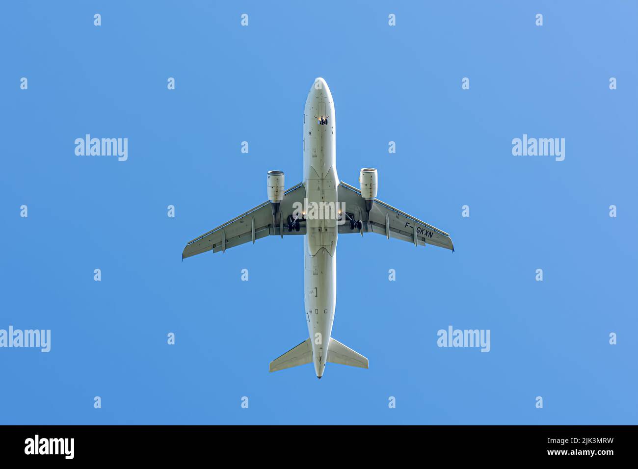 Flying aircraft view from below Stock Photo