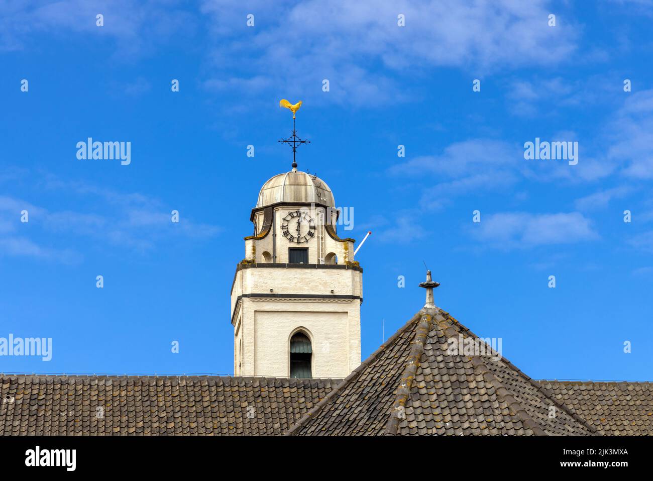 Close-up of the lock tower with weather vane of  Andreaskerk (Andrew's Church), a famous landmark in Katwijk aan Zee, South Holland, The Netherlands. Stock Photo