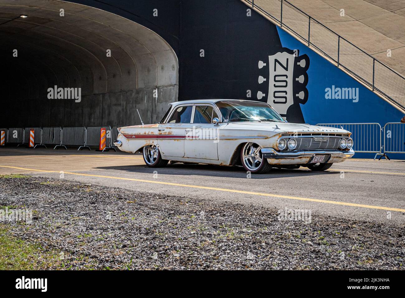 Lebanon, TN - May 14, 2022: Wide angle front corner view of an old 1961 Chevrolet Impala 4 Door Hardtop leaving a local car show. Stock Photo