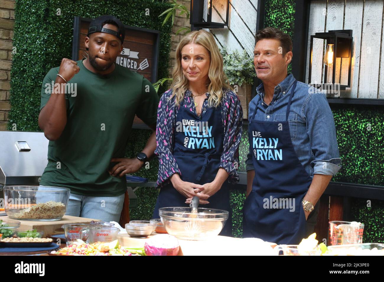 NEW YORK, NY July 28: Kevin Curry, Kelly Ripa and Ryan Seacrest on the set  of Live with Kelly & Ryan's Foodfluencer Friday Face off in New York City  on July 28,