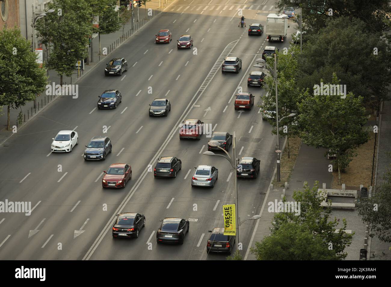 Bucharest, Romania - July 30, 2022: Cars on Magheru boulevard in Bucharest at sunset. Stock Photo