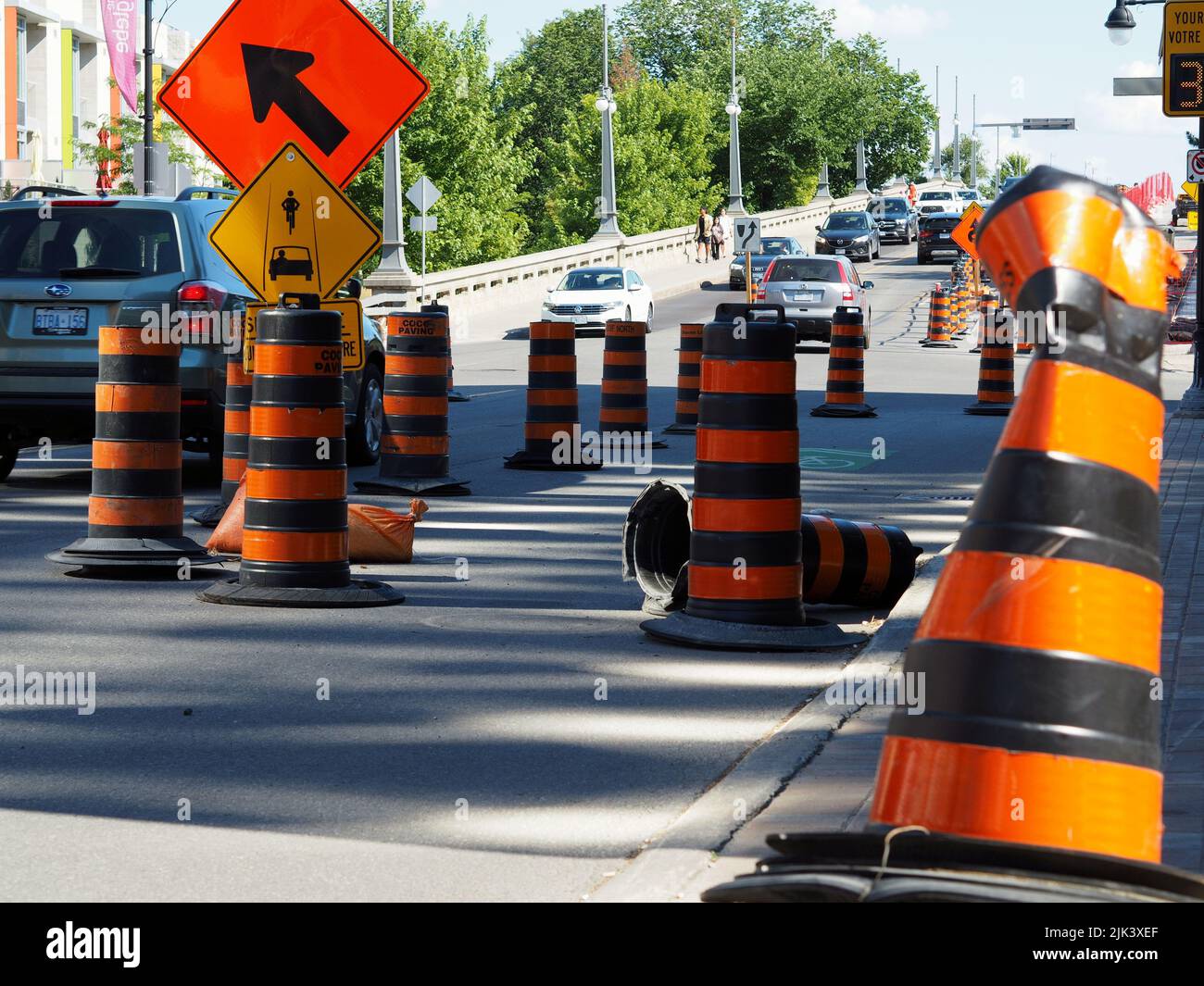 Roadworks on Bank Street by Lansdowne Park. Lots of bright orange traffic cones. Ottawa, Ontario, Canada. Stock Photo