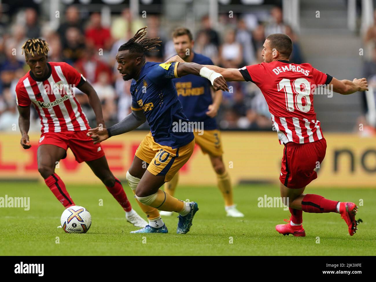 Newcastle's Allan Saint-Maximin with Bilbaoe's Oscar De Marcos (right) and Nico Willimas (left) as they battle for the ball during the pre-season friendly match at St. James' Park, Newcastle upon Tyne. Picture date: Saturday July 30, 2022. Stock Photo