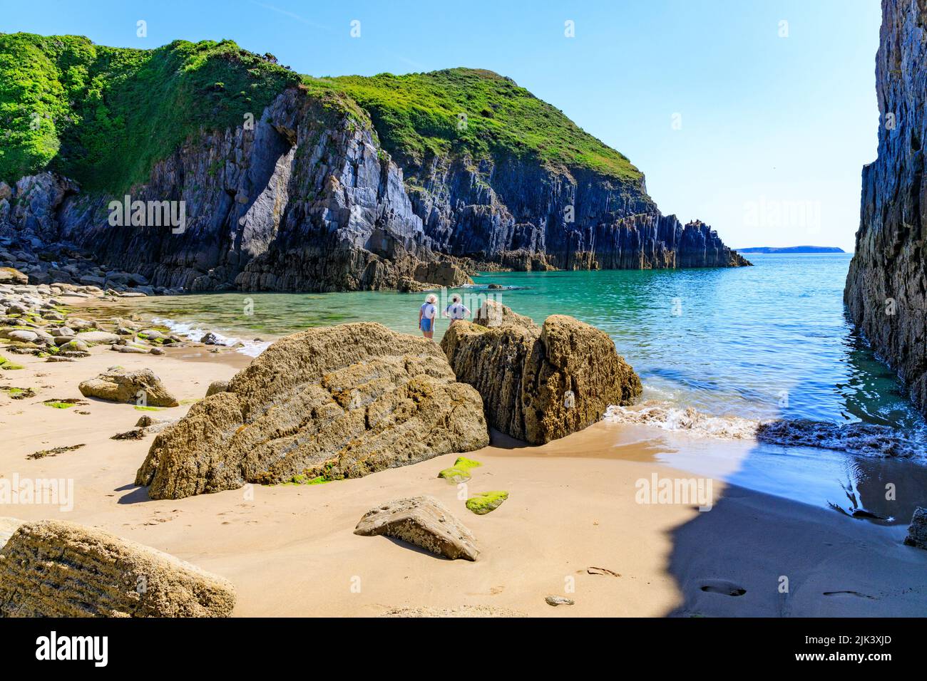 The dramatic limestone arch known as Church Doors on the Pembrokeshire Coast National Park at Skrinkle Haven, Pembrokeshire, Wales, UK Stock Photo