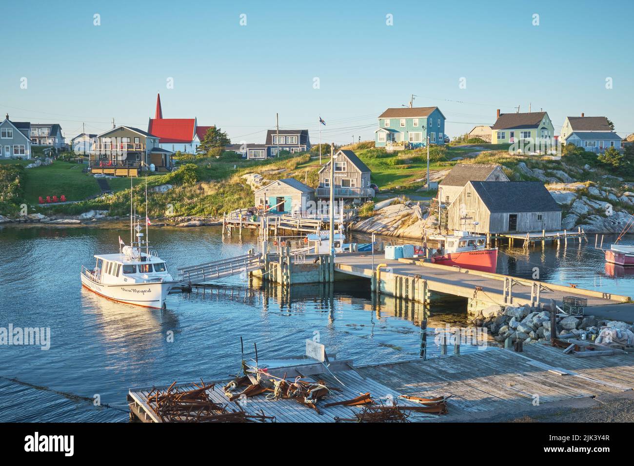Peggy's Cove is a small fishing village on the south shore of Nova Scotia Canada.  It is best know for it's iconic lighthouse which attracts over 700 Stock Photo