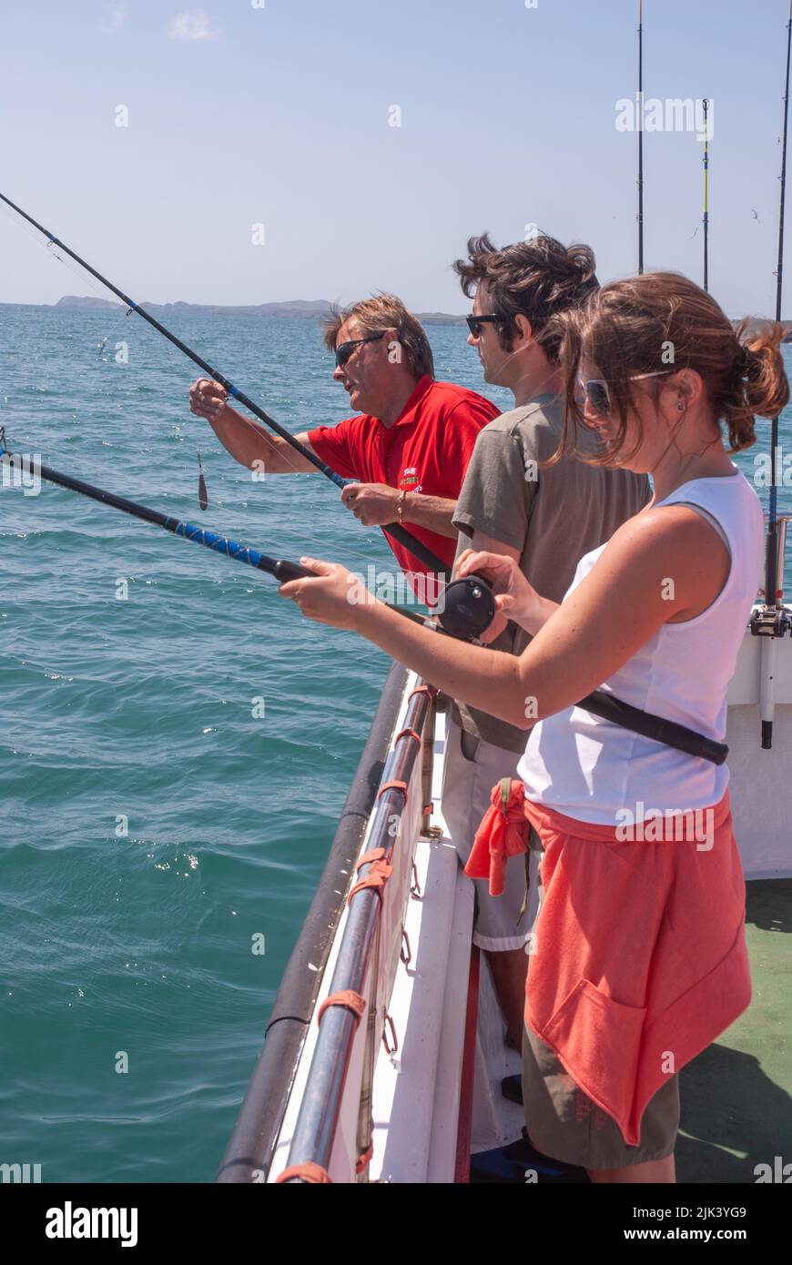 Mackerel fishing on holiday from Solva, Pembrokeshire, Wales, UK Stock