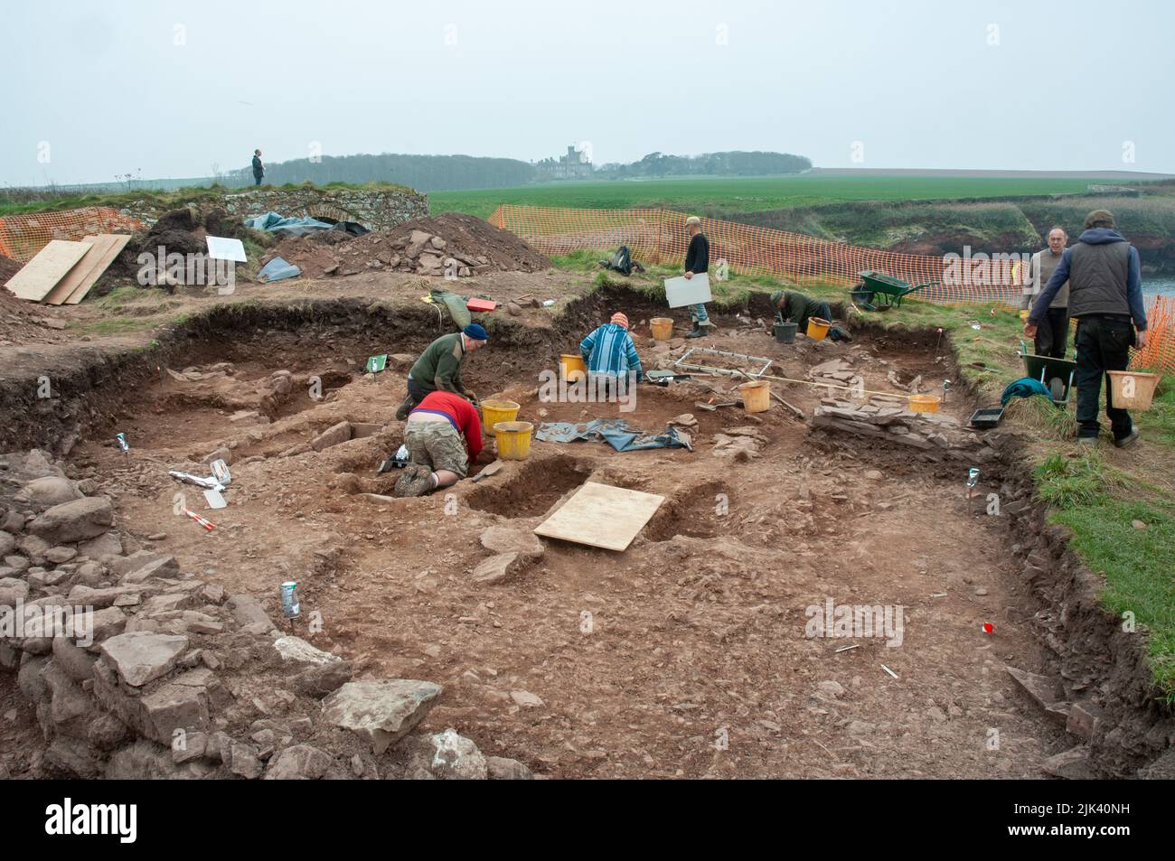 Archaeologists excavating ancient cemetery at St Bides, Pembrokeshire, Wales, UK Stock Photo