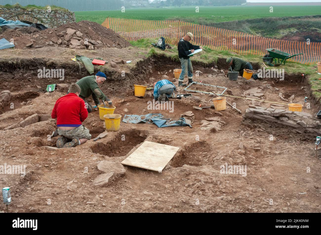 Archaeologists excavating ancient cemetery at St Bides, Pembrokeshire, Wales, UK Stock Photo