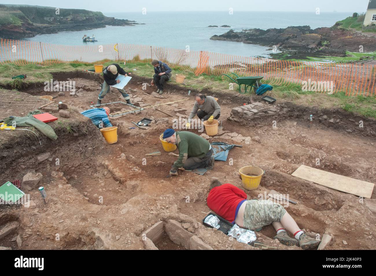 Archaeologists excavating ancient cemetery at St Bides, Pembrokeshire, Wales, UK Stock Photo