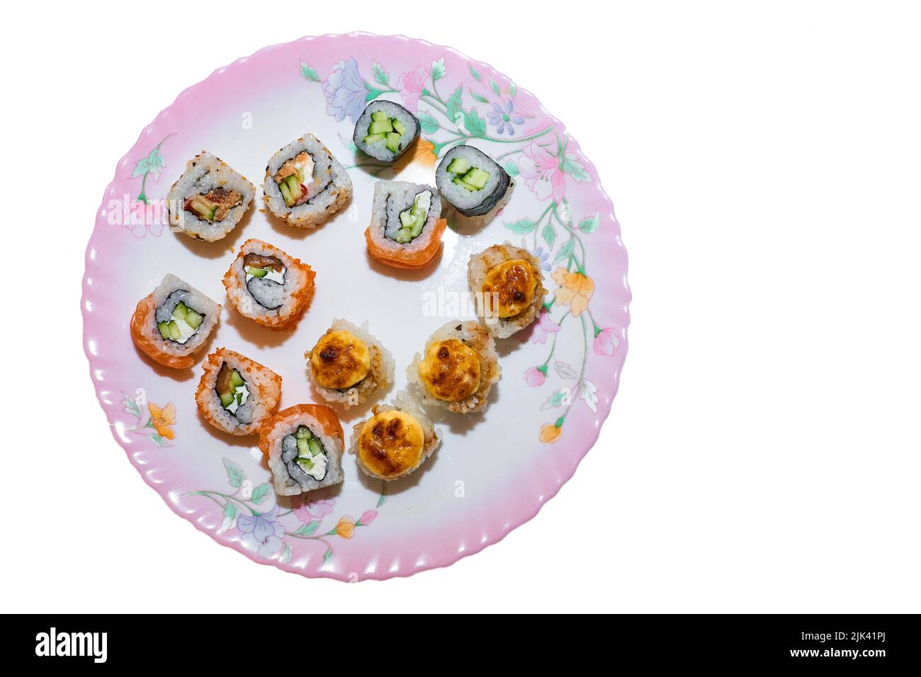 Varied set of delicious oriental sushi lounge on a porcelain ceramic pink plate Stock Photo