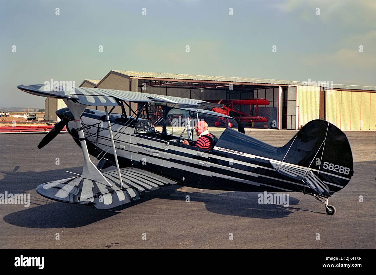 vintage 1980s photo of a christen eagle 2  582BB biplane outside a Richards Aeronautics hanger Stock Photo