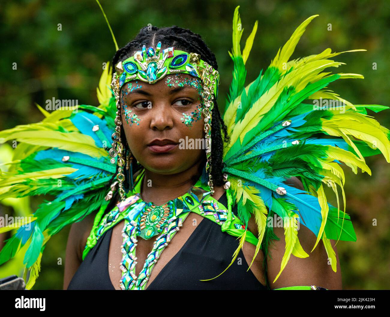 Harrogate, 30th July 2022. The Harrogate Carnival is taking place today under gloomy skies. A memmber of the Leeds West Indian Carnival takes a break. Picture Credit: ernesto rogata/Alamy Live News Stock Photo