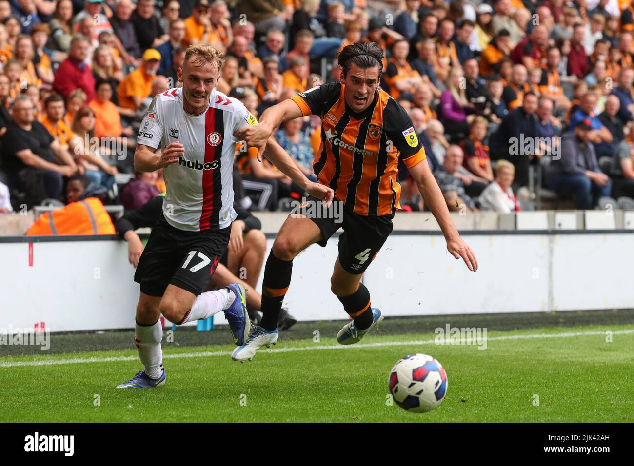 Mark Sykes #17 of Bristol City and Jacob Greaves #4 of Hull City challenge for the ball Stock Photo
