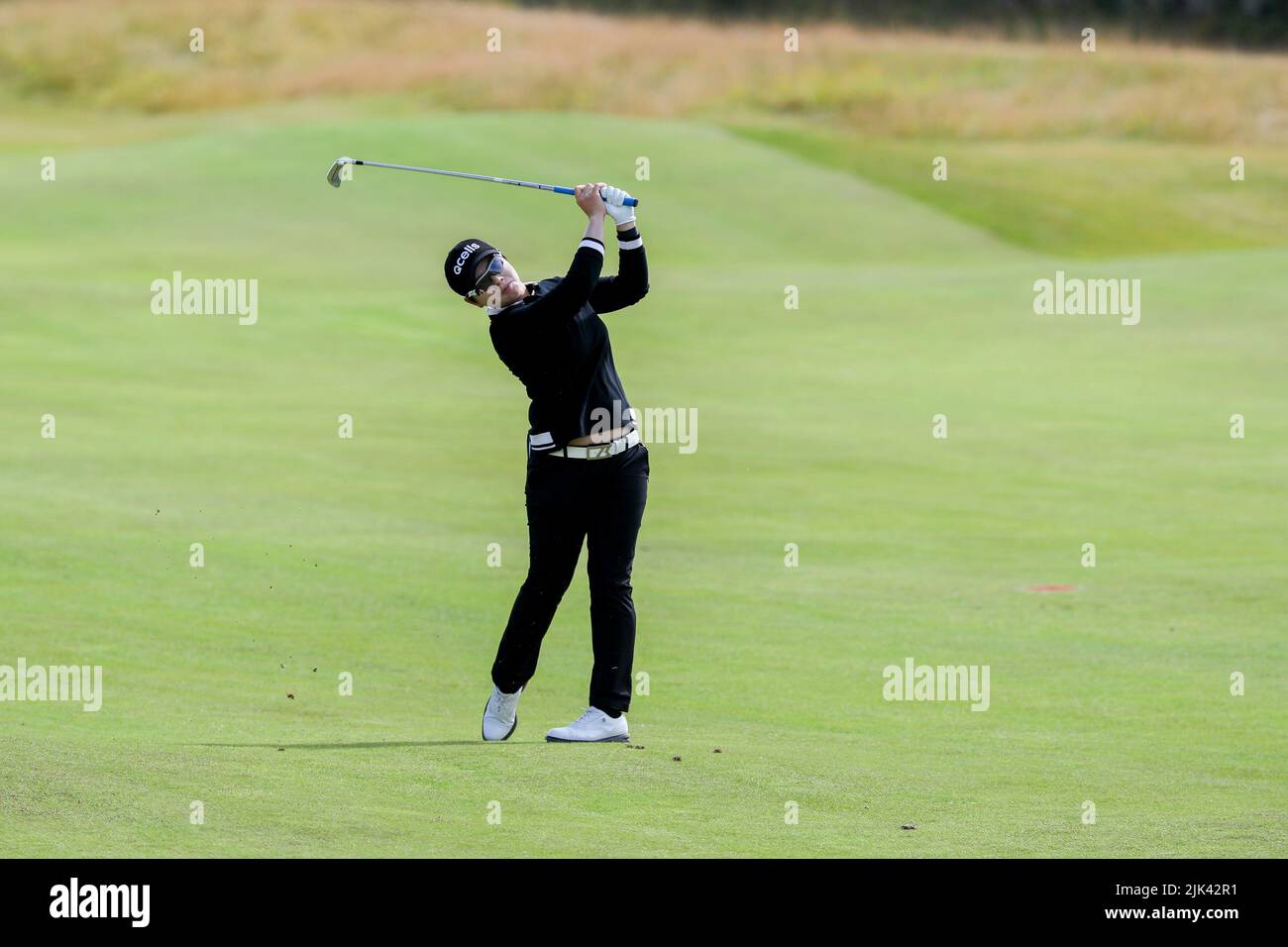 Irvine, UK. 30th July, 2022. The third round of the Trust Golf Women's Scottish Golf took place with 75 players making the cut. Heavy overnight rain from Friday into Saturday made for a softer and more testing course. Eun-Hee Ji playing her second shot on the 1th fairway, Credit: Findlay/Alamy Live News Stock Photo