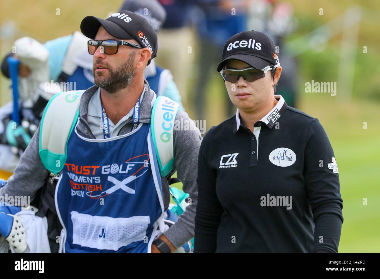 Irvine, UK. 30th July, 2022. The third round of the Trust Golf Women's Scottish Golf took place with 75 players making the cut. Heavy overnight rain from Friday into Saturday made for a softer and more testing course. Eun-Hee Ji with caddie. Credit: Findlay/Alamy Live News Stock Photo