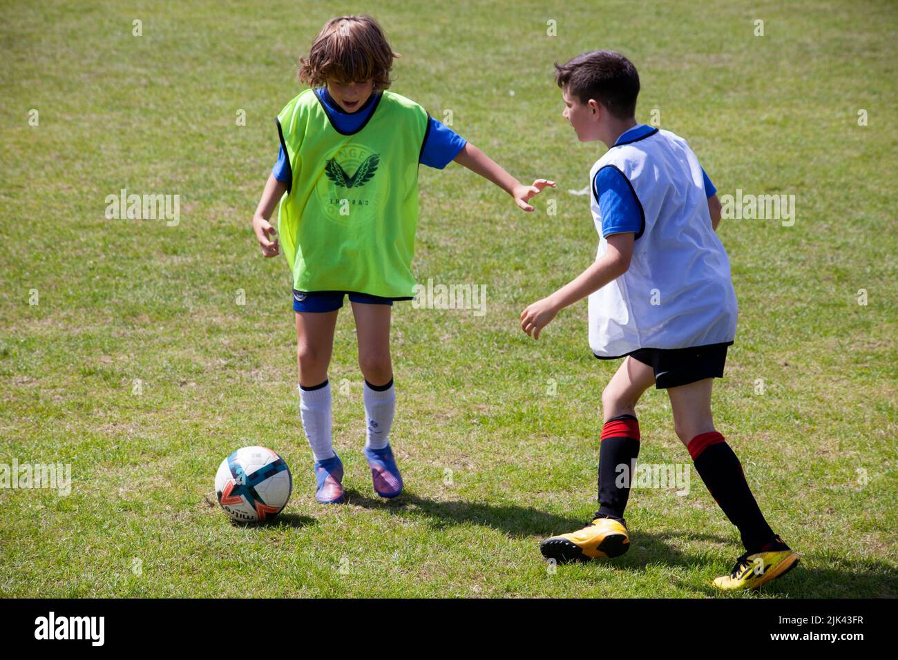 Boys playing football at Helensburgh, Argyll and Bute, Scotlan Stock Photo